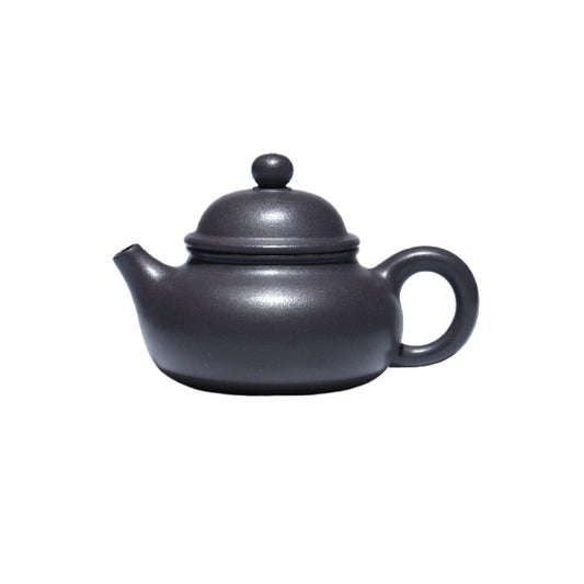 Dark grey Rongtian Dezhong teapot, on a white background.